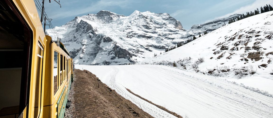 Train along mountain range