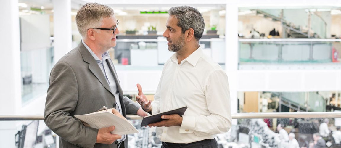 Co-workers having a conversation