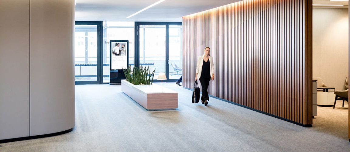 Woman standing in lobby